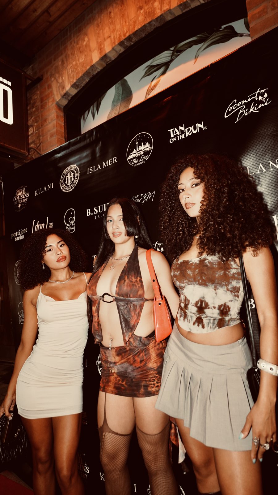 Group of guests on the ViCES Swim Week 2026 press wall