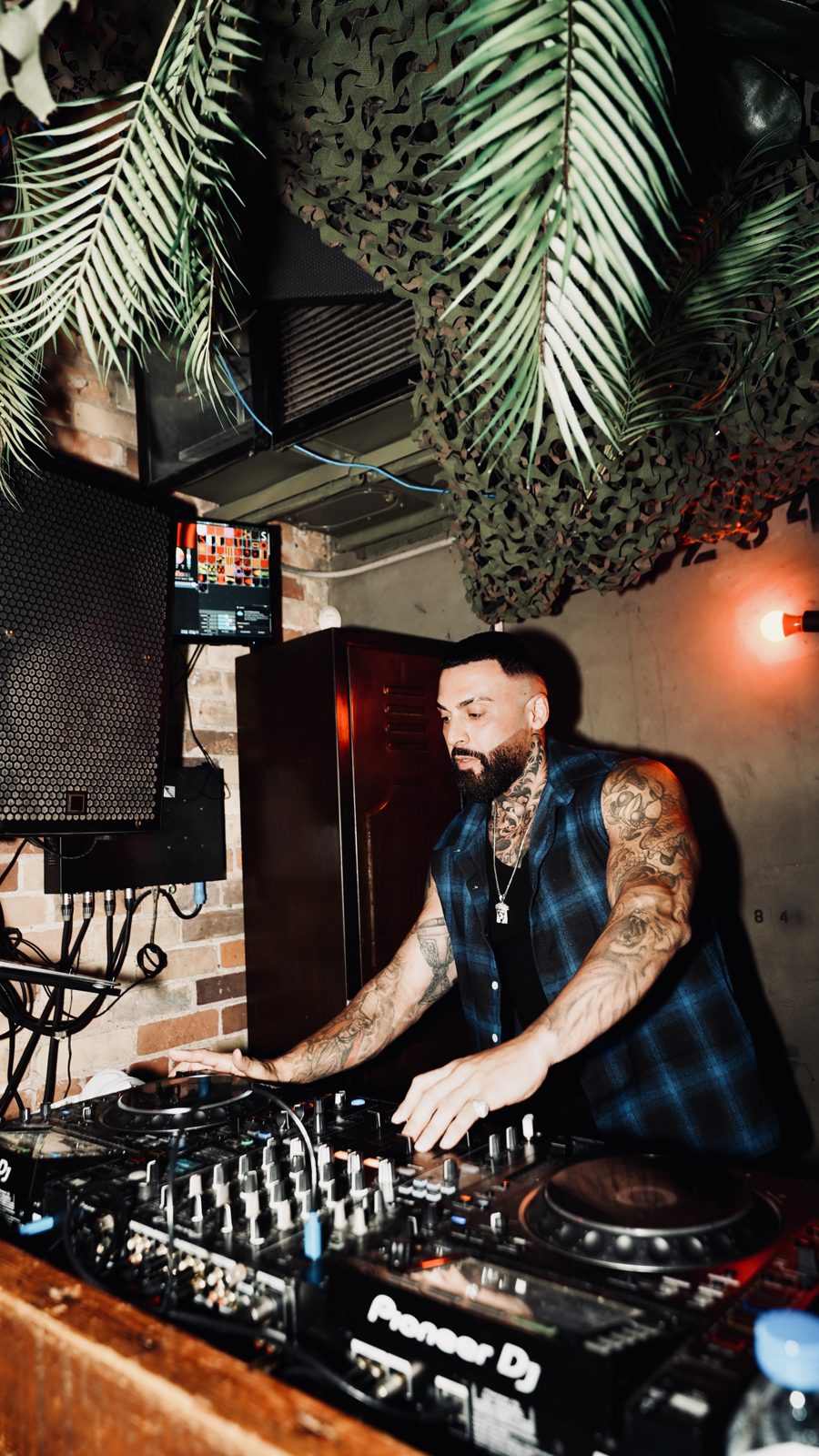 DJ set in the palm-lit main room at Escobar Toronto